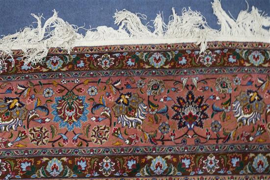 A Tabriz cream ground medallion carpet 400 x 305cm